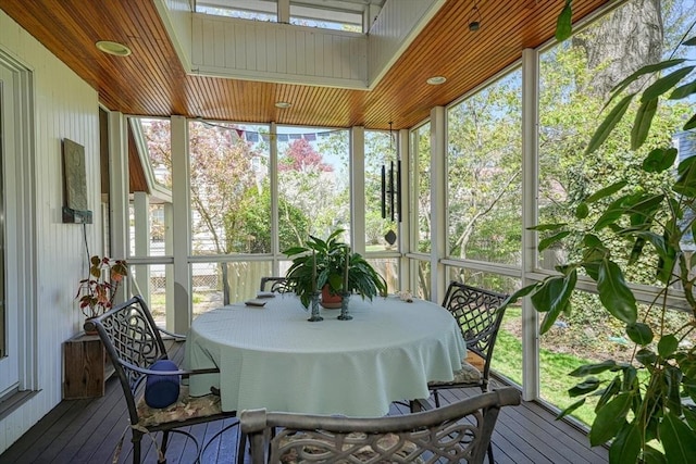 sunroom / solarium featuring outdoor dining area