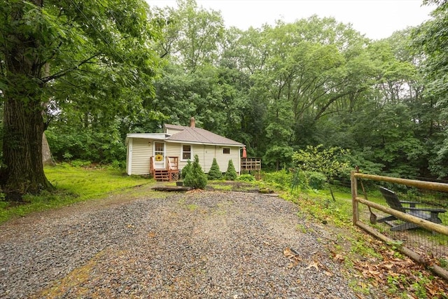 170 Walnut Rd, Wrentham, MA 02093 - view of front of house featuring gravel driveway and a chimney