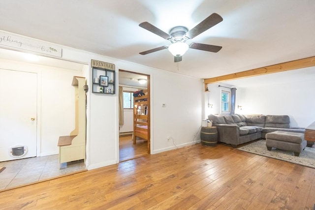 170 Walnut Rd, Wrentham, MA 02093 - living area with healthy amount of natural light, a ceiling fan, and light wood-style flooring