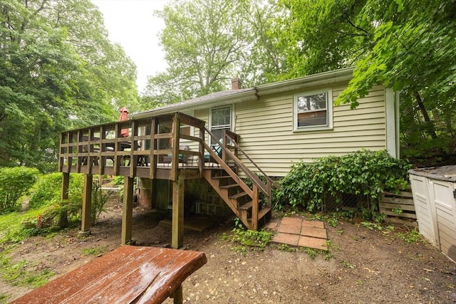 170 Walnut Rd, Wrentham, MA 02093 - back of house featuring a wooden deck, stairway, and a chimney