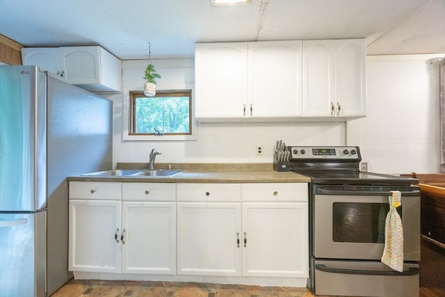 170 Walnut Rd, Wrentham, MA 02093 - kitchen with appliances with stainless steel finishes and white cabinetry