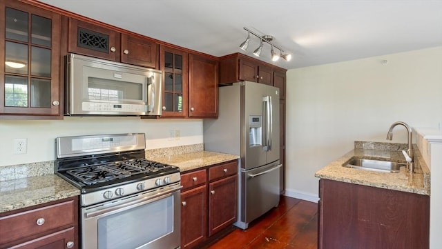 141 State St Unit 2, Newburyport, MA 01950 - kitchen featuring stainless steel appliances, a sink, light stone countertops, glass insert cabinets, and dark wood-style floors