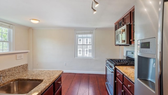 141 State St Unit 2, Newburyport, MA 01950 - kitchen with stainless steel appliances, a sink, dark wood-style flooring, light stone counters, and baseboards
