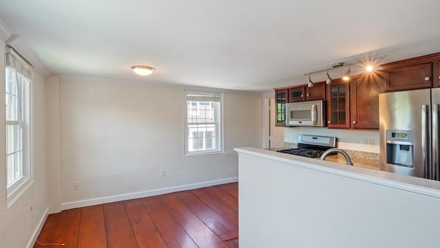 141 State St Unit 2, Newburyport, MA 01950 - kitchen with stainless steel appliances, wood-type flooring, baseboards, glass insert cabinets, and track lighting