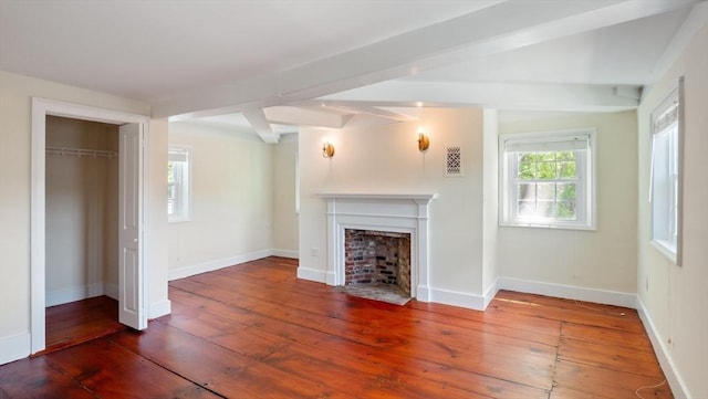 141 State St Unit 2, Newburyport, MA 01950 - unfurnished living room featuring hardwood / wood-style flooring, a fireplace with flush hearth, and baseboards