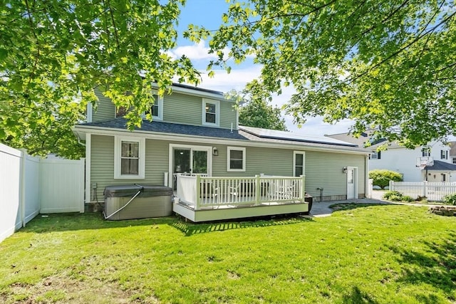 37 Gorham St, Chelmsford, MA 01824 - back of house with a hot tub, a deck, and solar panels