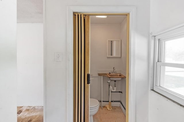 37 Gorham St, Chelmsford, MA 01824 - bathroom featuring toilet, a sink, and crown molding