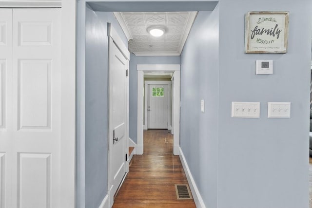 37 Gorham St, Chelmsford, MA 01824 - hallway with an ornate ceiling, baseboards, dark wood finished floors, and ornamental molding