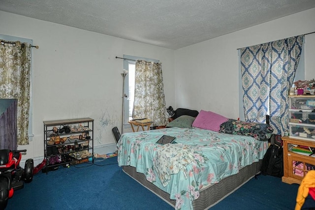 7 Prospect St, Woburn, MA 01801 - carpeted bedroom with a textured ceiling