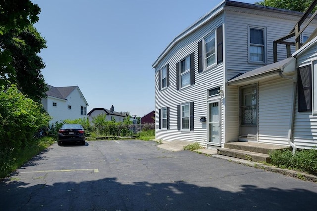 7 Prospect St, Woburn, MA 01801 - view of side of home featuring uncovered parking