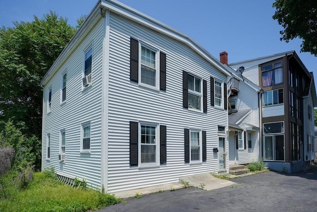 7 Prospect St, Woburn, MA 01801 - view of property exterior with a chimney