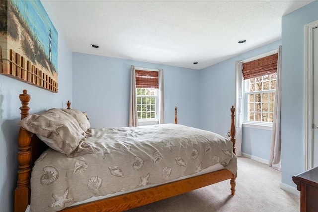 bedroom featuring baseboards and carpet flooring