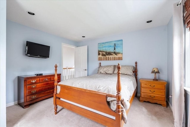 carpeted bedroom with baseboards