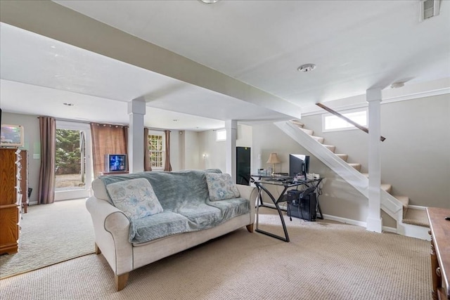 living room featuring stairway, carpet, and visible vents