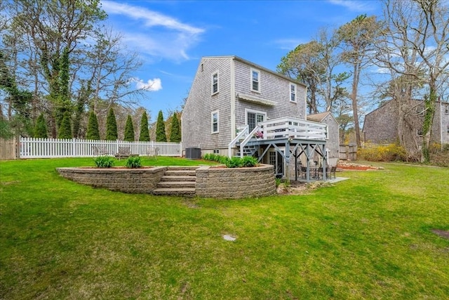 back of house with fence, a yard, a deck, and stairway