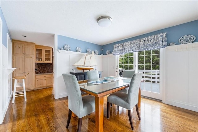 dining area with wood finished floors