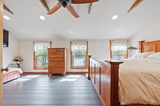 bedroom with recessed lighting, hardwood / wood-style floors, baseboards, and ceiling fan