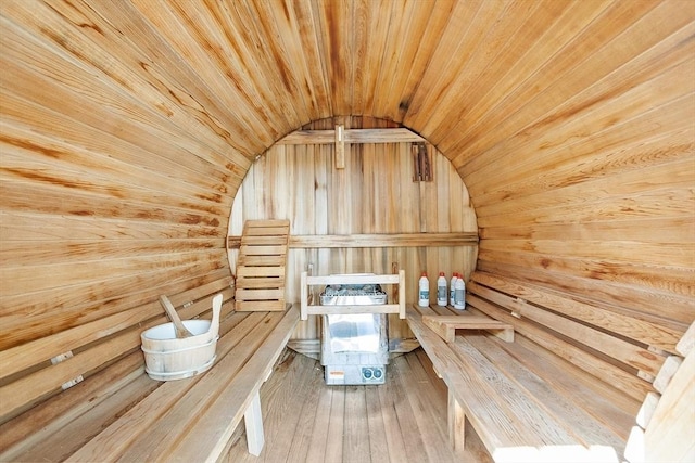sauna / steam room featuring wooden ceiling, wooden walls, and wood-type flooring