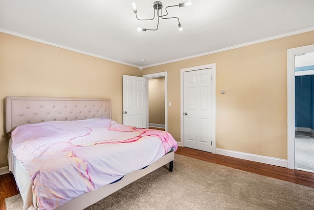 bedroom featuring hardwood / wood-style flooring and ornamental molding