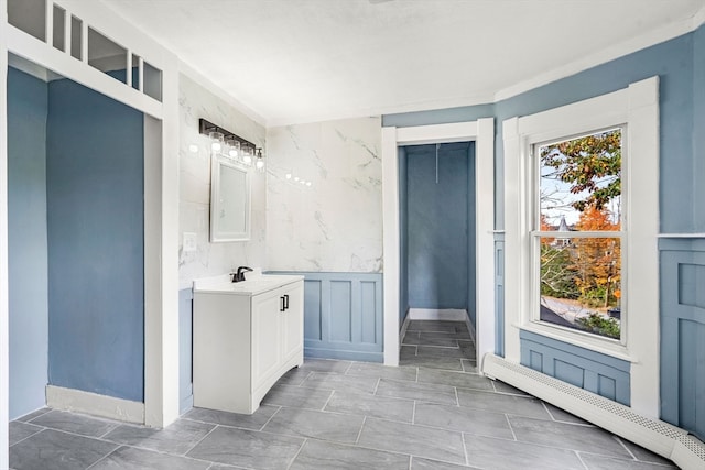 bathroom with vanity and baseboard heating