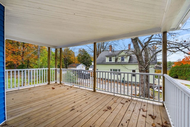 wooden deck featuring a storage unit