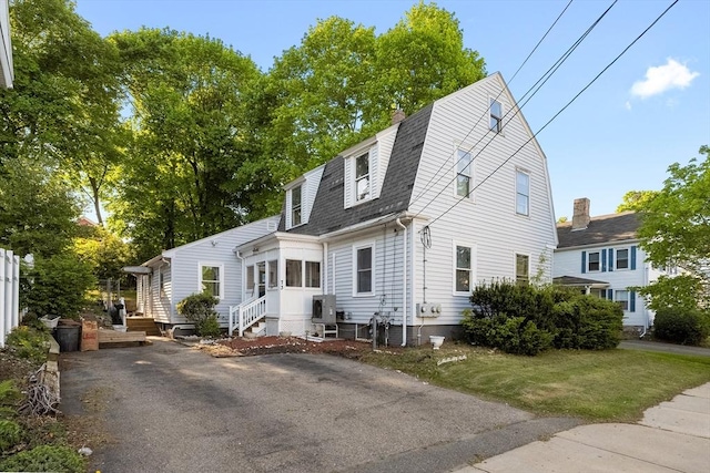 73 Lincoln Ave, Saugus, MA 01906 - colonial inspired home with a shingled roof, a gambrel roof, a front yard, and a chimney