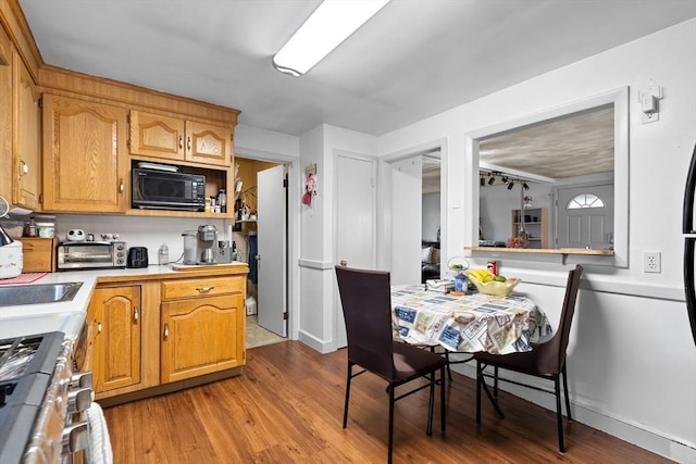 73 Lincoln Ave, Saugus, MA 01906 - kitchen with black microwave, light countertops, stainless steel range, and light wood-type flooring