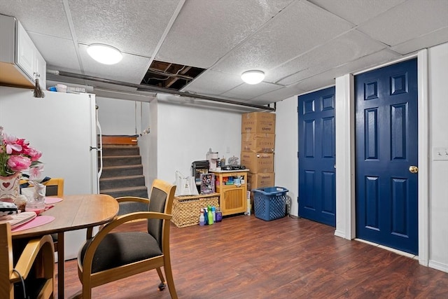 73 Lincoln Ave, Saugus, MA 01906 - finished below grade area featuring wood finished floors, a paneled ceiling, stairway, and freestanding refrigerator