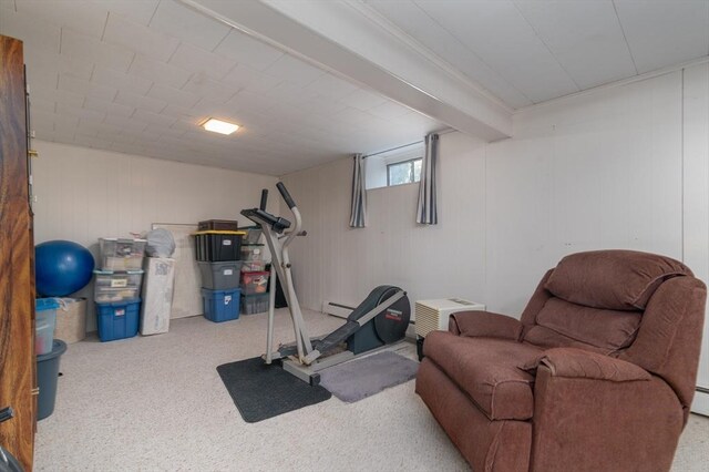 exercise room featuring a baseboard heating unit