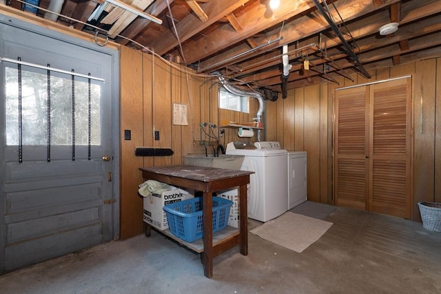 below grade area with wood walls and washing machine and dryer