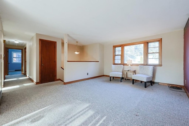 unfurnished room with a wealth of natural light and carpet floors