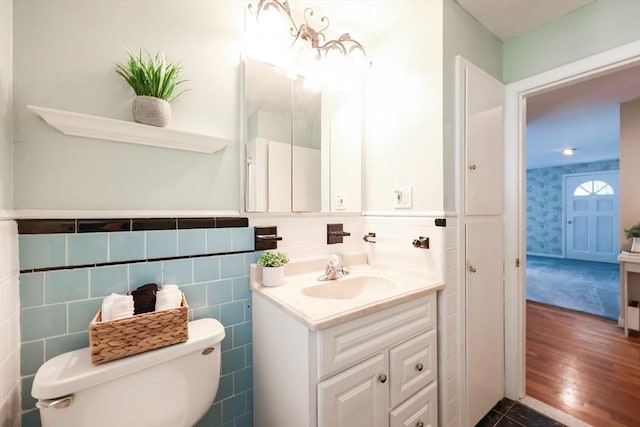 33 Page Rd, North Attleboro, MA 02760 - bathroom with vanity, a wainscoted wall, and wood finished floors