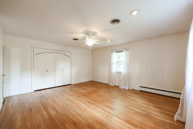 33 Page Rd, North Attleboro, MA 02760 - unfurnished bedroom with baseboard heating, light wood-type flooring, a closet, and ceiling fan