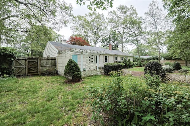 33 Page Rd, North Attleboro, MA 02760 - view of home's exterior featuring a chimney and a gate
