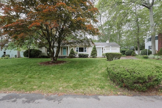 33 Page Rd, North Attleboro, MA 02760 - obstructed view of property with an attached garage, a front yard, and a chimney