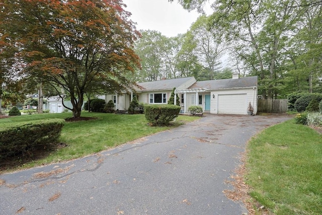 33 Page Rd, North Attleboro, MA 02760 - view of front facade with an attached garage, asphalt driveway, and a chimney