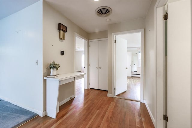 33 Page Rd, North Attleboro, MA 02760 - hall with light wood-style floors and baseboards