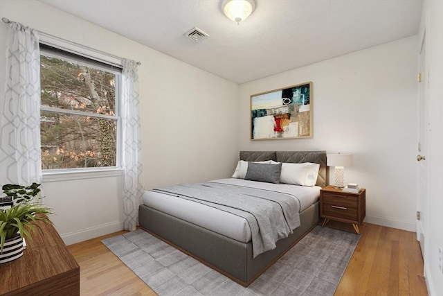 bedroom featuring light wood-type flooring