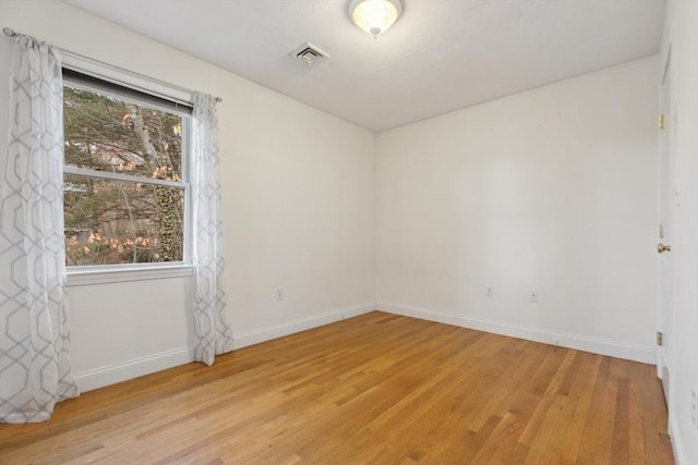 empty room with light wood-type flooring