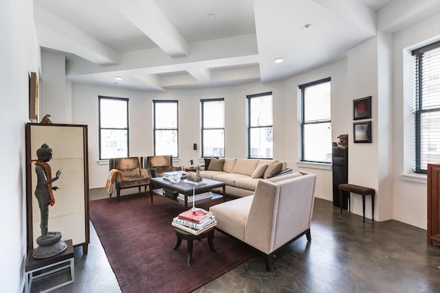 living room with finished concrete floors, beamed ceiling, and recessed lighting