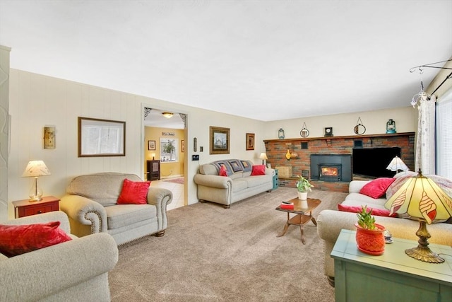 living room with a brick fireplace and light carpet