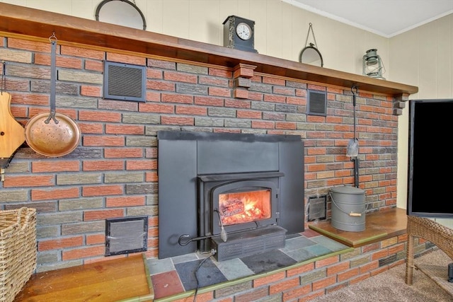 details with crown molding and a wood stove