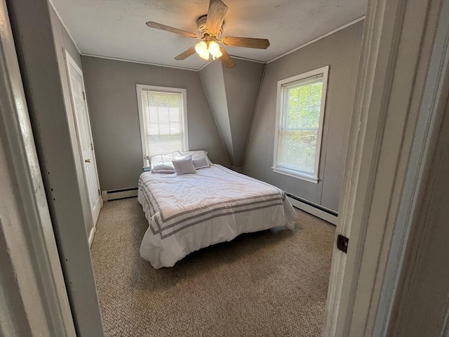 bedroom featuring a baseboard heating unit, light carpet, multiple windows, and crown molding