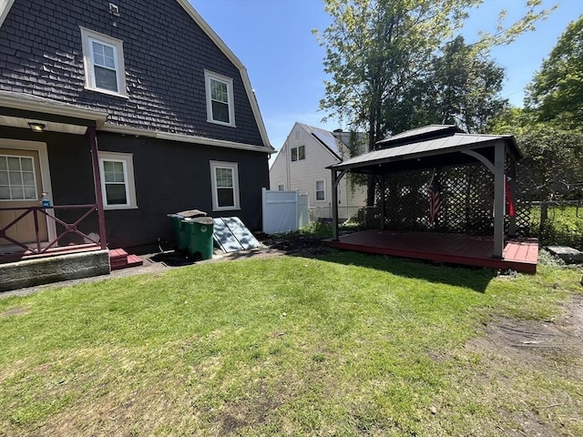 view of yard featuring a gazebo and a wooden deck