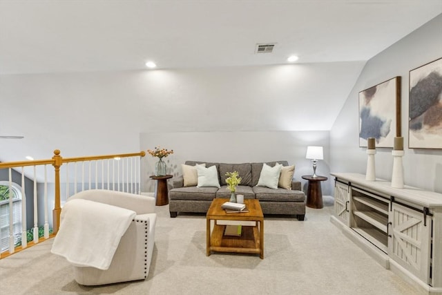 living room with visible vents, recessed lighting, lofted ceiling, and light colored carpet