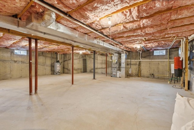 below grade area with heating unit and gas water heater