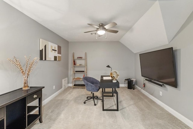 carpeted home office with baseboards, ceiling fan, and lofted ceiling