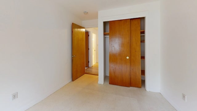 unfurnished bedroom with a closet