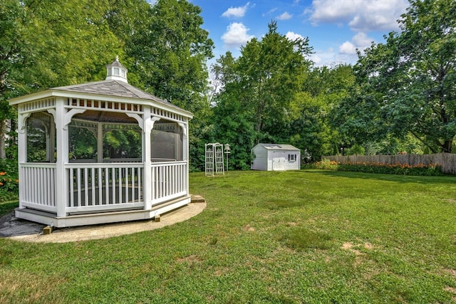 view of yard featuring a storage shed and a gazebo