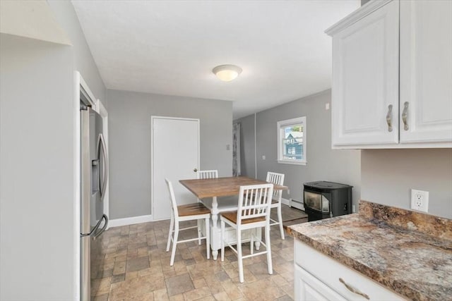 29 Balcomb St Unit 29, Salem, MA 01970 - dining space with stone finish flooring, baseboards, and a baseboard radiator
